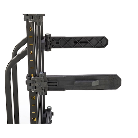 Close-up of a DEWALT adjustable support arm with measurement markings on a vertical metal frame, used for holding tools or materials.