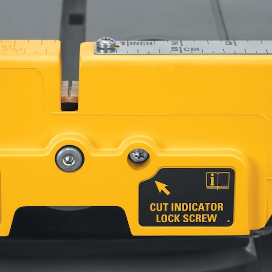 Close-up of DEWALT tool with cut indicator lock screw and measuring scale in inches and centimeters.