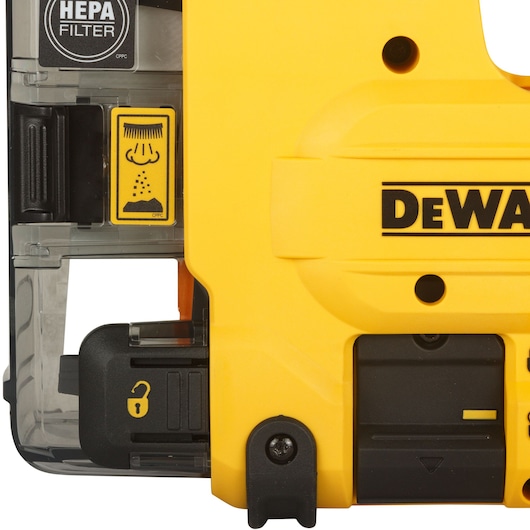 Close-up of a DEWALT D25304DH HEPA filter housing with lock indicator and filter warning sticker.
