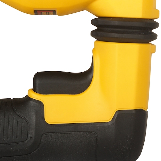 Close-up of DEWALT D25333K yellow and black power tool grip with textured surface.