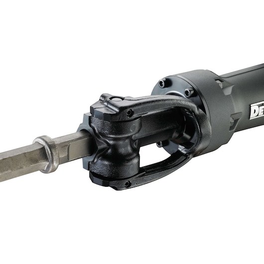 Close-up of DEWALT D25960K demolition hammer, showing its metal chisel and robust attachment.
