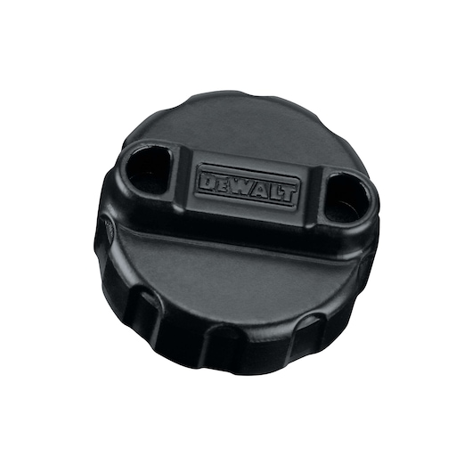 A close-up image of a black DEWALT replacement tool part, designed with a round shape and two holes, featuring the DEWALT logo embossed on the top.