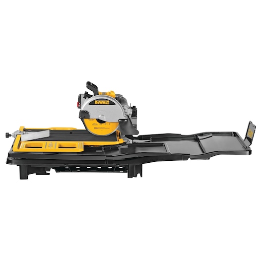 A DEWALT tile saw with a yellow and black body, featuring a sliding cutting table and an extended support tray. The saw is designed for precise tile cutting in construction or renovation projects.