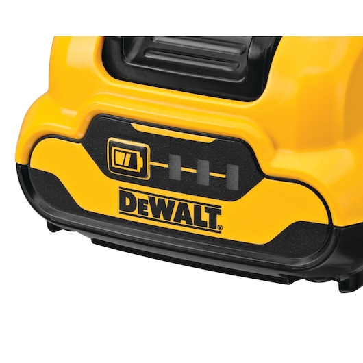 Close-up view of a DEWALT power tool battery, showing the logo and charge indicator icons on a yellow and black battery housing.