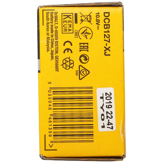Close-up of DEWALT DCB127 battery box showing product details, barcode, symbols, and manufacturing info.