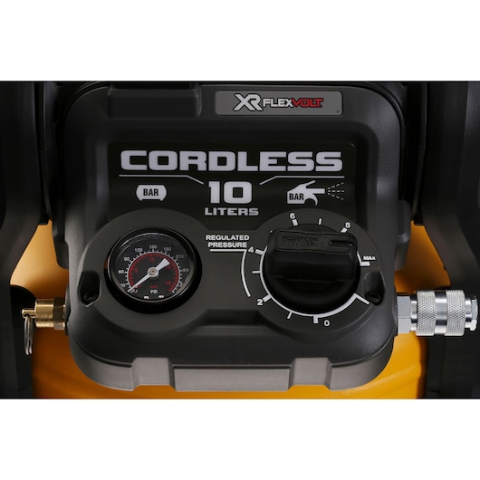 Close-up of DEWALT XR FLEXVOLT cordless air compressor control panel, gauge and regulator, 10 liters capacity.