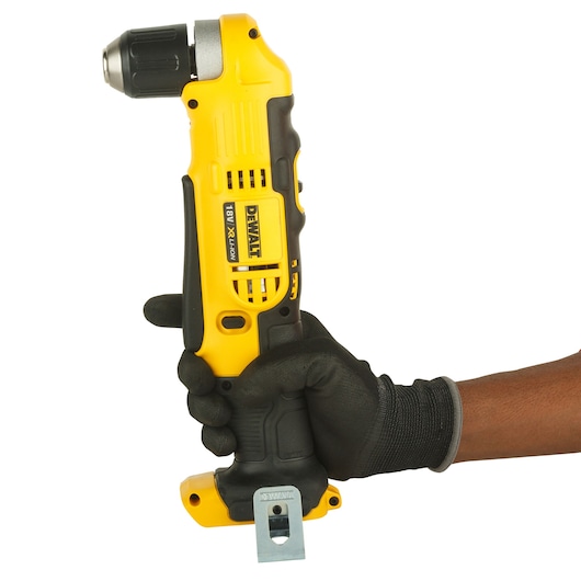 A person wearing a black glove is holding a yellow and black DEWALT 18V cordless right-angle drill against a white background.