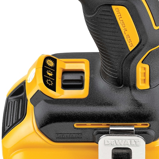 Close-up of DEWALT brushless drill handle and control, showing light settings and clip.