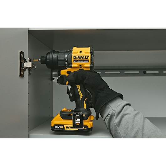 DEWALT drill DCD803NT-XJ, DCD803NT used on cabinet. Photography product.