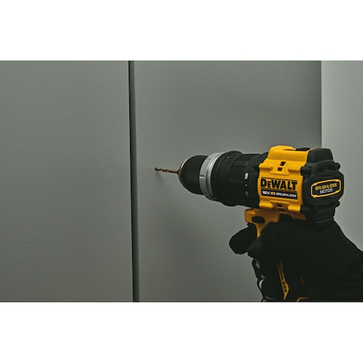 DEWALT drill DCD803P2T-QW, DCD803P2T used on wall. Photography product category.