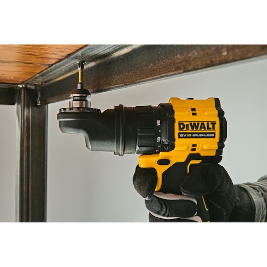 DEWALT drill DCD803P2T-QW, DCD803P2T in use under metal surface. Photography product category.