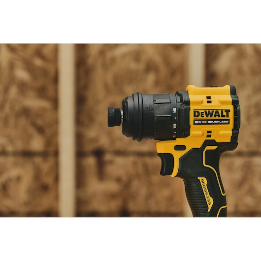 DEWALT DCD803P2T-QW, DCD803P2T brushless drill, yellow and black, shown in workshop. Photography category.