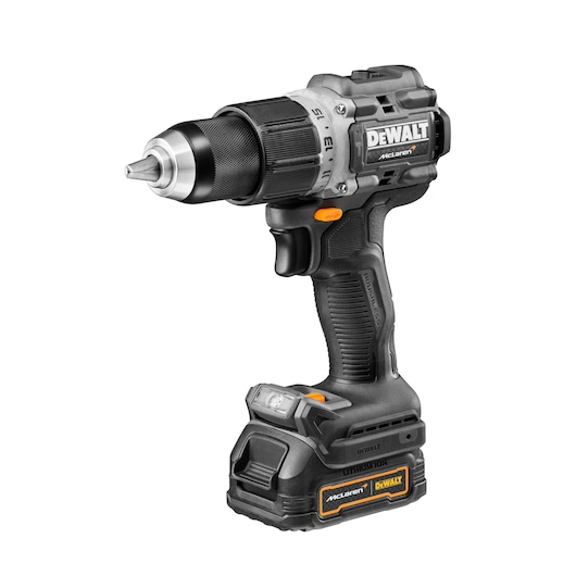 A DEWALT cordless power drill with a black and silver design, featuring a brushless motor and lithium-ion battery. The drill has orange details and is branded with 'DEWALT' and 'McLaren'.