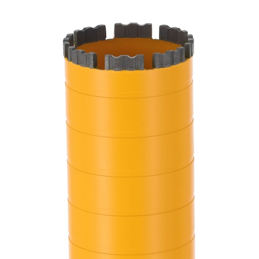Yellow cylindrical DEWALT core drill bit with segmented cutting edge for masonry and concrete applications.