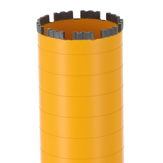 Yellow DEWALT core drill bit with segmented cutting edge, shown close-up on a white background.