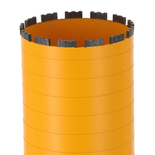Close-up of a DEWALT cylindrical orange core drill bit with segmented cutting edge.