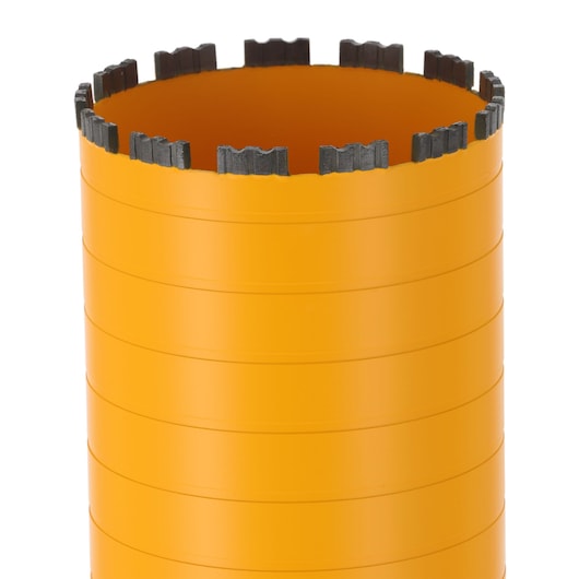 Close-up of an orange DEWALT core drill bit with segmented cutting teeth at the top.