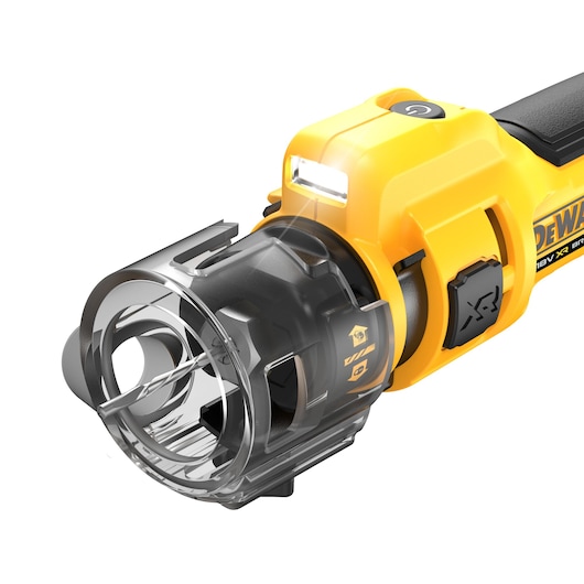 Close-up of a DEWALT cordless drywall cut-out tool with blade, LED light, and safety guard.
