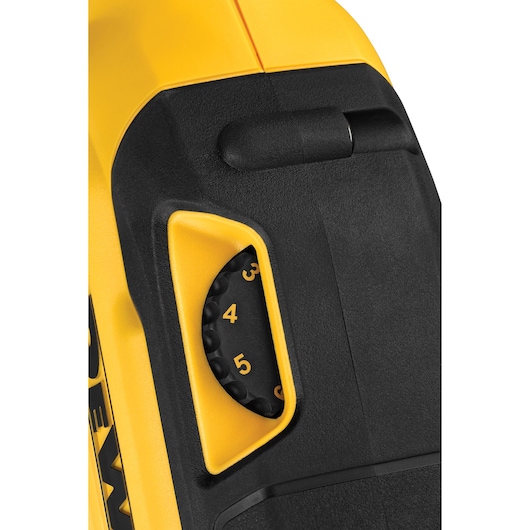 Close-up of a DEWALT tool showing a numbered black dial set in yellow and black casing.