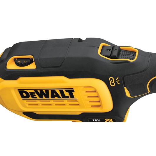 Close-up of a DEWALT 18V XR cordless tool with black and yellow casing and control settings.