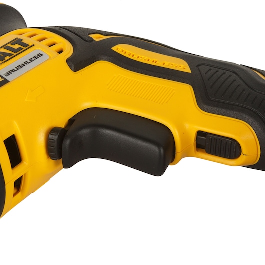 Close-up of a DEWALT yellow and black power tool handle and trigger with brushless label.
