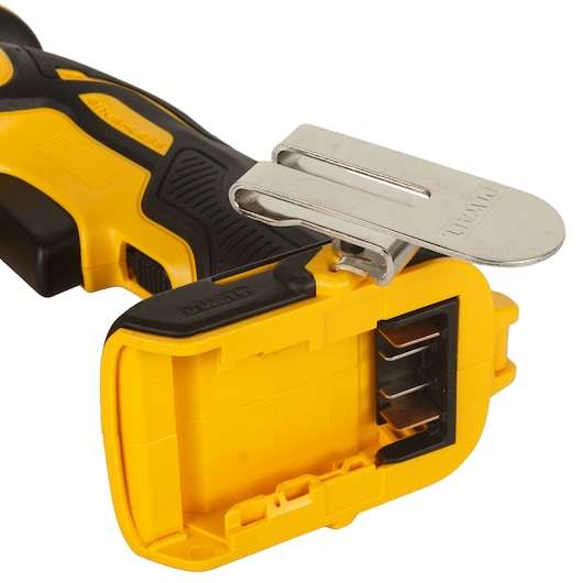 Close-up of a yellow DEWALT power tool handle with a metal belt clip and battery slot.