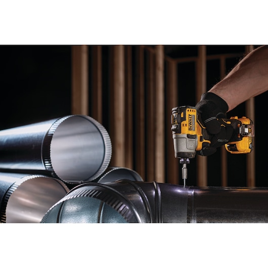 DEWALT DCK2111L2T-XE, DCF801N used to drill metal pipes in construction. Product shown in photography category.