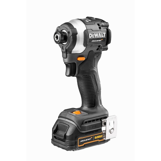 A DEWALT cordless impact driver, model DCF85ME2GT, featuring a black and silver design with orange accents. The tool has a brushless motor and a lithium-ion battery, and displays both DEWALT and McLaren branding.