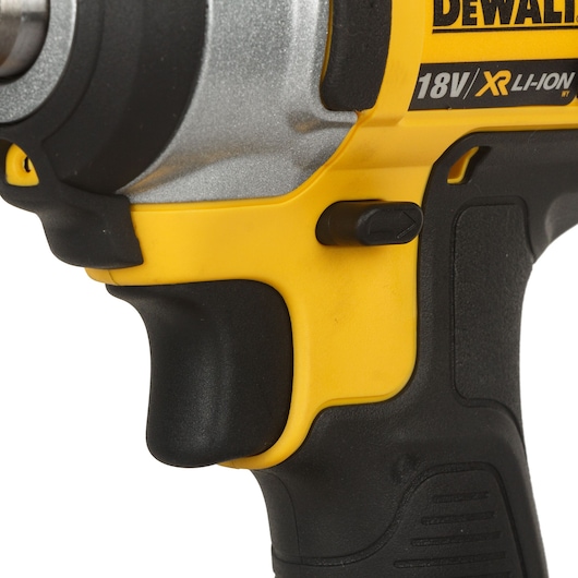 Close-up of a DEWALT 18V XR Li-Ion cordless tool handle and trigger, yellow and black color.