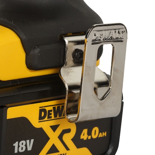 Close-up of a DEWALT XR 18V 4.0Ah battery with a metal belt clip attached.