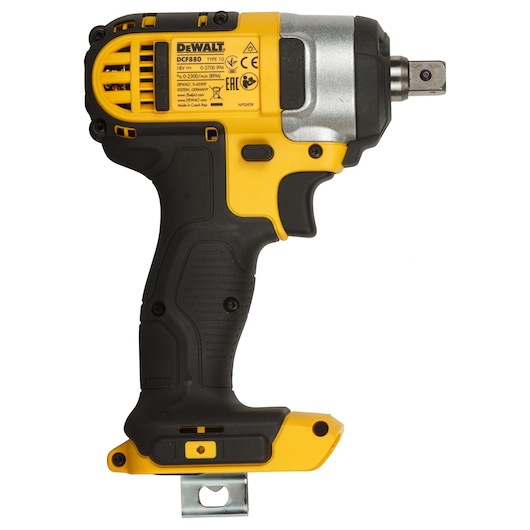 Cordless DEWALT impact wrench in yellow and black, shown from the side with metal attachment and label visible.