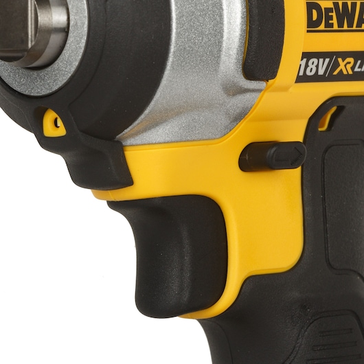 Close-up of a yellow and black DEWALT 18V cordless power tool handle and trigger.