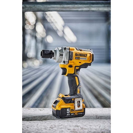 DEWALT DCF894N cordless impact wrench with 18V battery shown on an industrial surface.