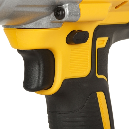 Close-up of a DEWALT DCF899P2-QW power tool handle showing the trigger and yellow-black grip.