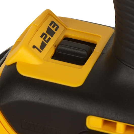 Close-up of DEWALT tool speed selector with numbers 1, 2, 3 in yellow and black.