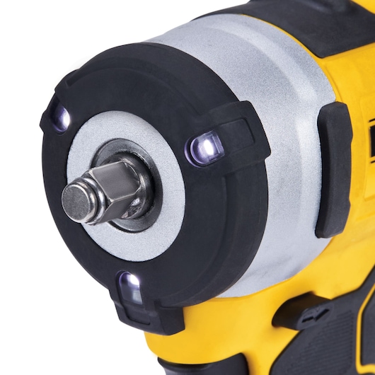 Close-up of a DEWALT cordless impact wrench showing the metal head, LEDs, and yellow housing.