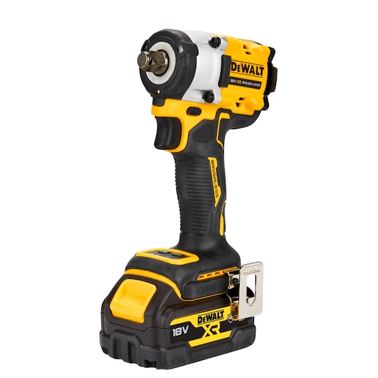 A DEWALT 18V XR cordless impact wrench with a brushless motor, black and yellow design, and ergonomic grip. The tool features a battery pack at the base and a metal belt clip on the side.