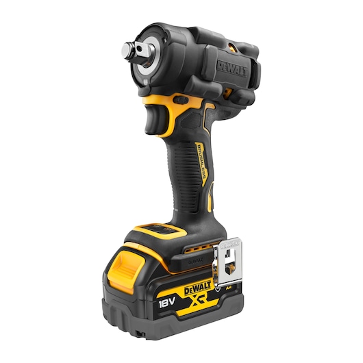A Dewalt DCF921P2G 18V cordless impact wrench with brushless motor, featuring a yellow and black design, ergonomic grip, metal belt clip, and battery pack attached at the bottom.