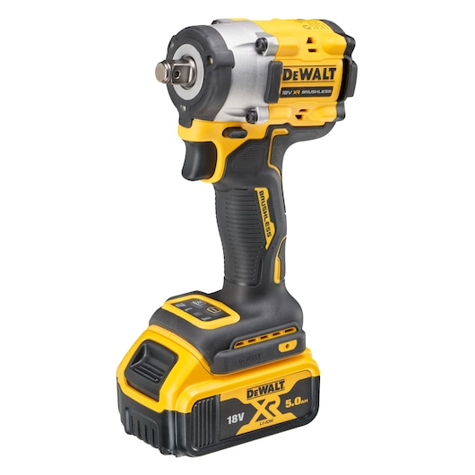 A DEWALT DCF921P2T 18V XR Brushless cordless impact wrench with a 5.0Ah Li-ion battery. The tool has a yellow and black design and ergonomic handle.