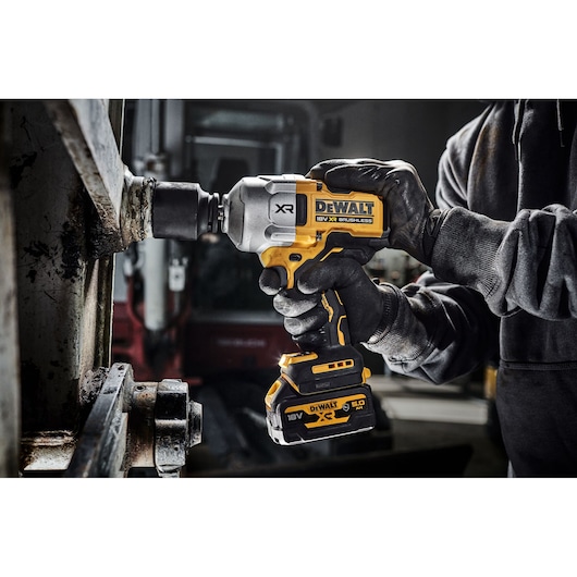 DEWALT impact driver in use, SKUs DCF961N, DCF961N-XJ, shown in industrial setting.