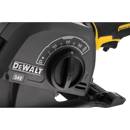 Close-up of DEWALT 54V power tool adjustment dial with millimeter scale and PUSH marking.