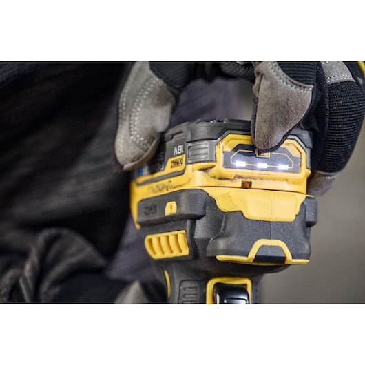 DEWALT tool close-up, gloved hand, DCG404NT and DCG404S2T-QW SKUs visible, photography product category.