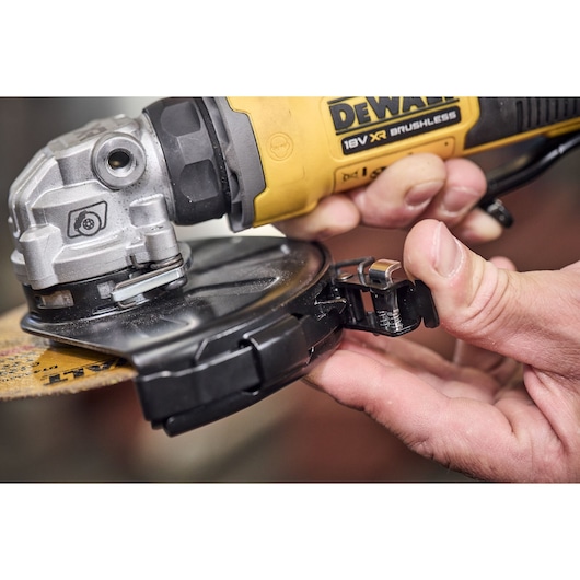 DEWALT DCG404NT and DCG404S2T-QW angle grinder close-up showing disc guard adjustment.