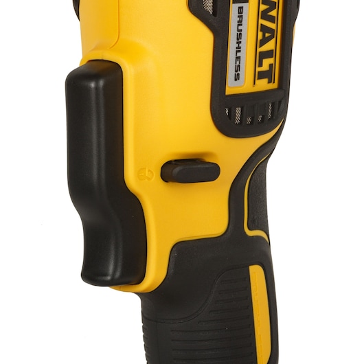 Close-up of a DEWALT brushless tool handle showing switch, trigger, and textured yellow and black grip.