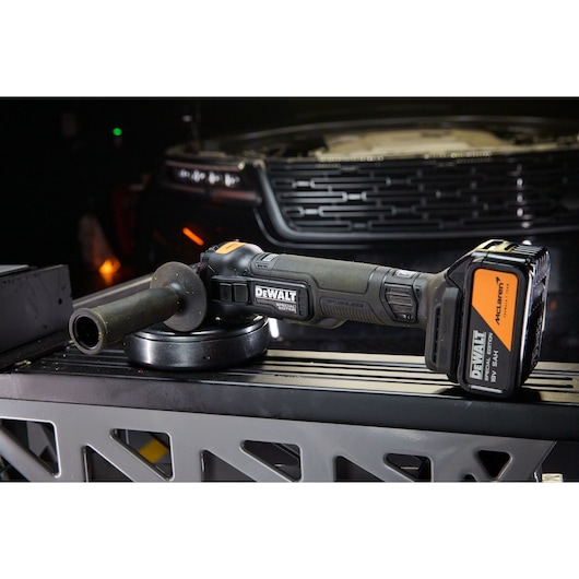 DEWALT cordless tool DCG45MP2T-QW, DCG45MP2T shown on workbench.