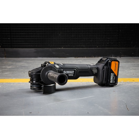 DEWALT cordless tool, SKUs DCG45MP2T-QW, DCG45MP2T, on concrete floor. Photo category.