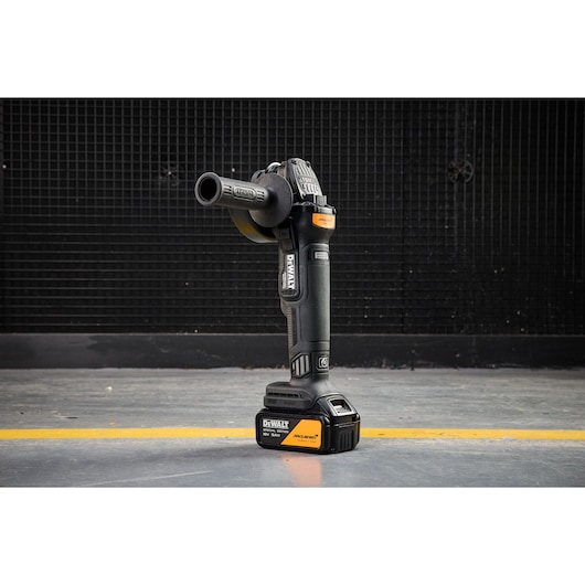 DEWALT cordless tool, SKUs DCG45MP2T-QW, DCG45MP2T, standing upright on concrete floor, photography category.