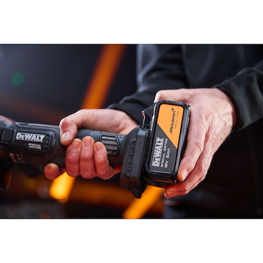 DEWALT DCG45MP2T-QW, DCG45MP2T Special Edition tool held by hand, close-up shot, photography category.