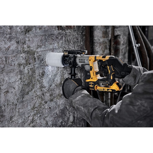 DEWALT DCH172NT-XJ, DCH172NT used by gloved hand drilling into wall. Photography product image.