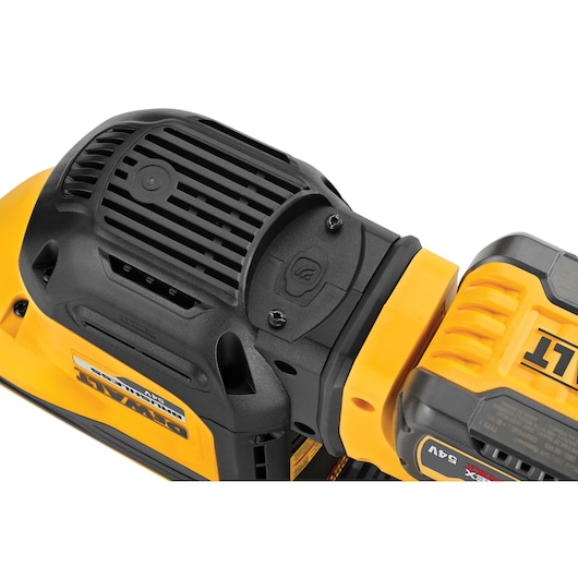 Close-up of DEWALT power tool showing vent, battery pack and yellow-black casing.